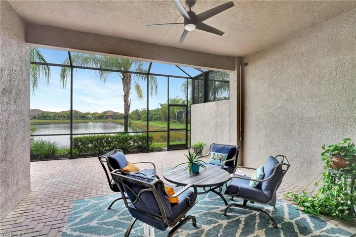 Sunroom featuring a water view