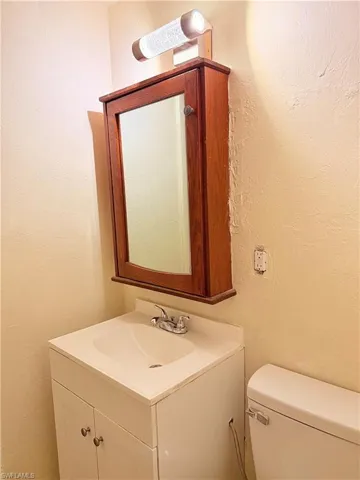 Bathroom with vanity and toilet