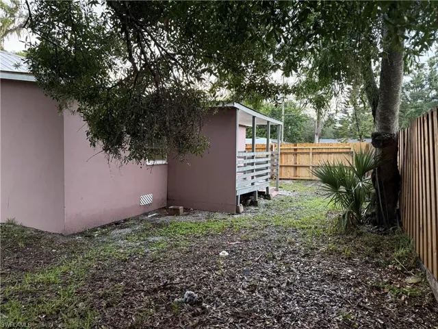 View of fenced backyard