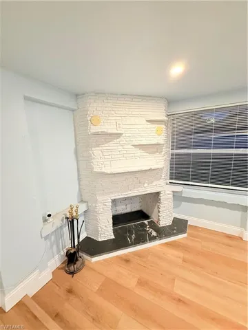 Detailed view of wood finished floors and baseboards