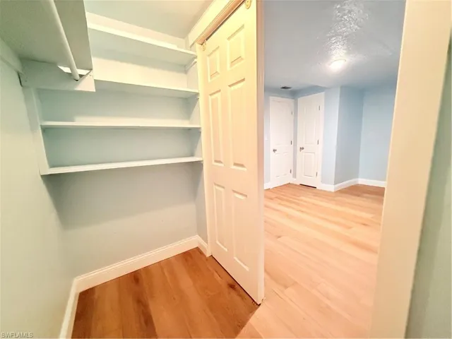 Hall with wood finished floors