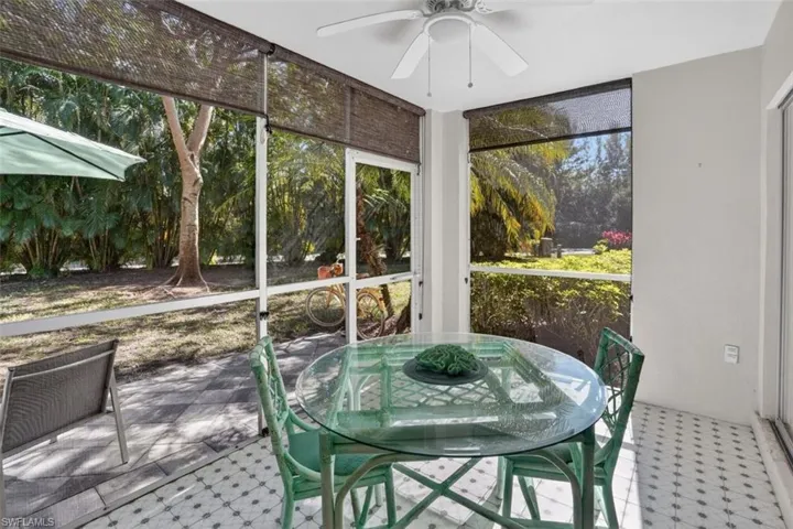Bright, screened-in lanai with door to rear patio
