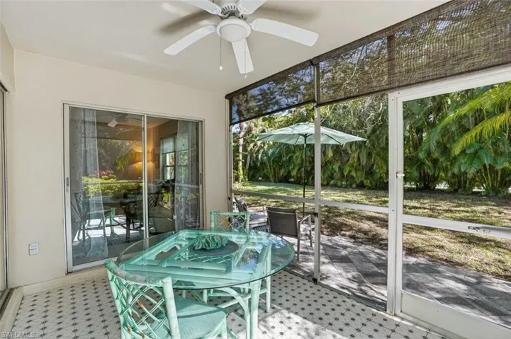 Screened in lanai with ceiling fan and tile flooring