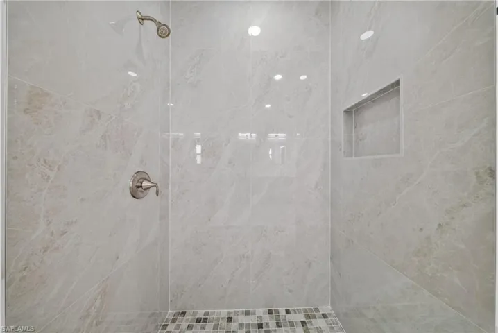 Full bathroom with tiled shower