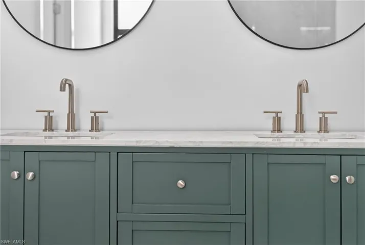 Bathroom featuring double vanity
