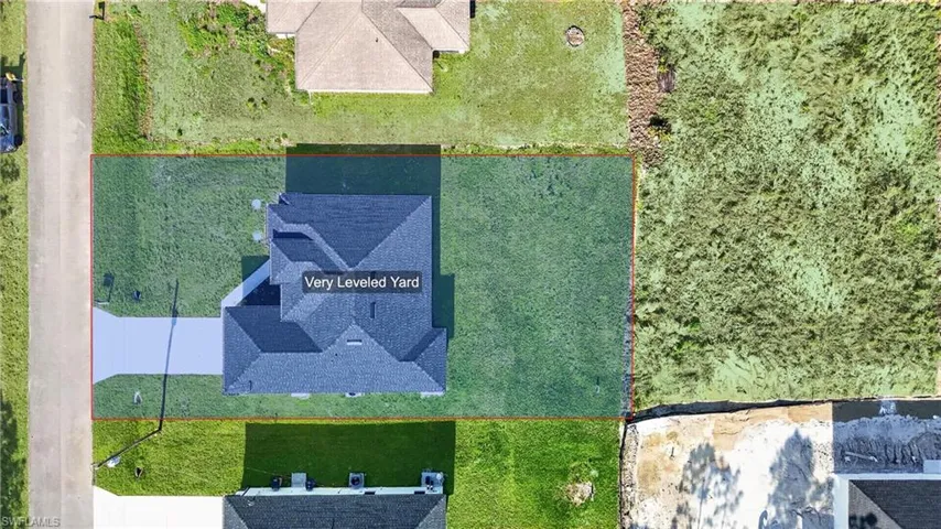 Aerial view of property and surrounding area featuring property parcel outlined