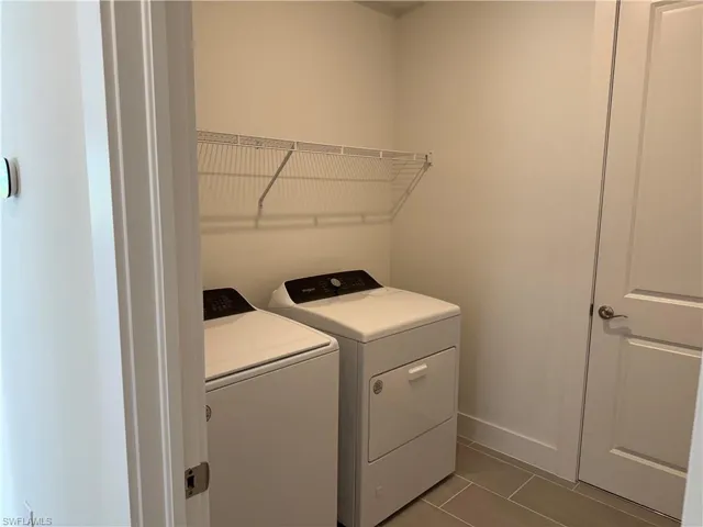 Laundry room with washer and gas dryer