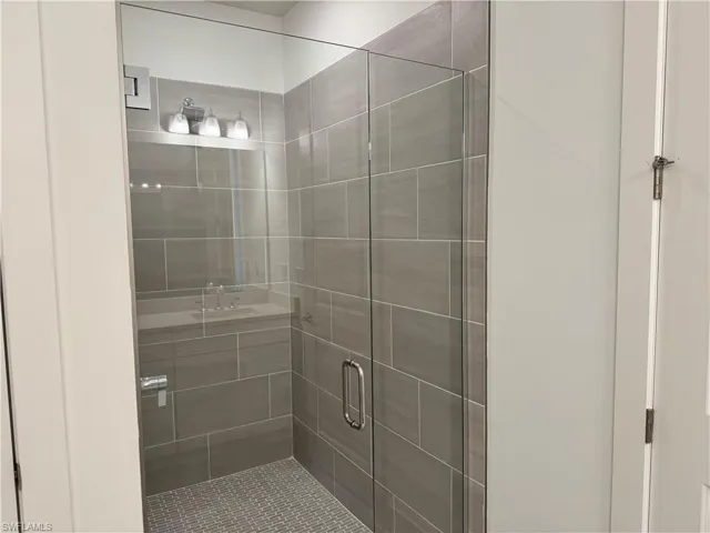 Luxe, walk-in shower with beautiful shower floor and wall tile