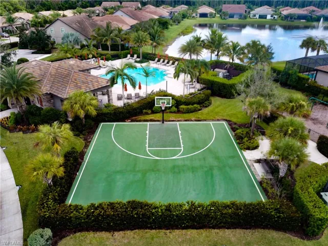 View of sport court with a water view