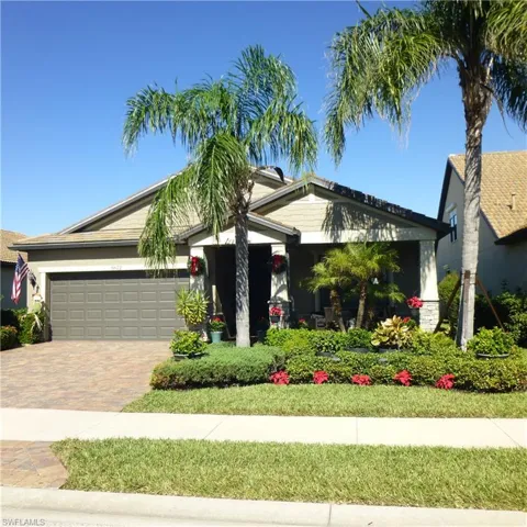 View of front facade featuring a garage