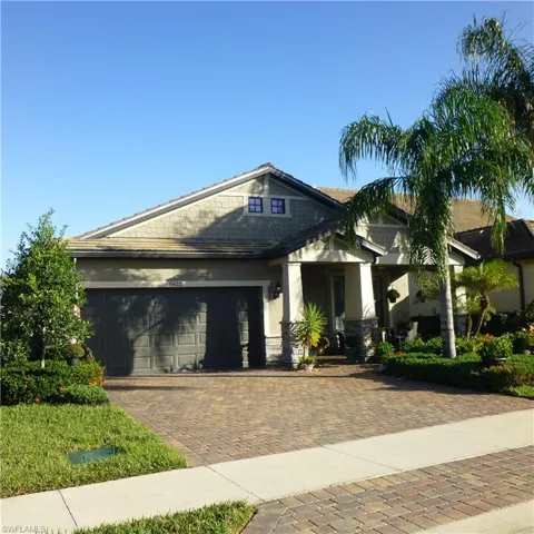 View of front featuring a garage and porch.