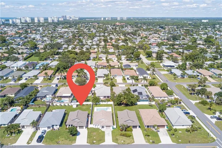 Aerial view of property's location with nearby suburban area