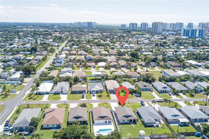 Aerial view of property's location with nearby urban area