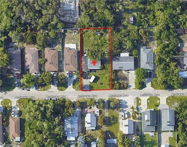 Aerial view of residential area featuring property boundaries highlighted