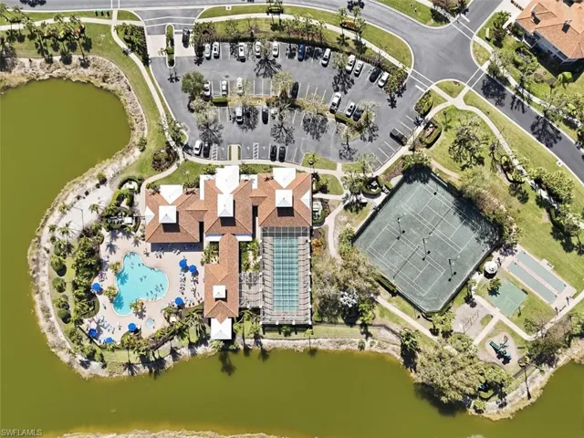 Aerial view of property and surrounding area with a large body of water