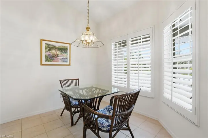 Dining space with a chandelier and light tile patterned floors