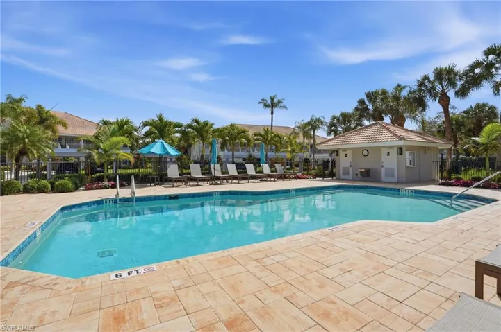 Community pool with a patio