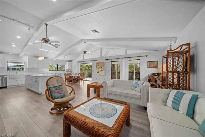 Living room featuring ceiling fan, light wood finished floors, healthy amount of natural light, and recessed lighting