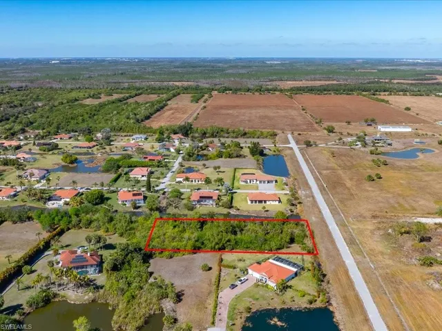 Overview of rural landscape with property boundaries highlighted and a large body of water