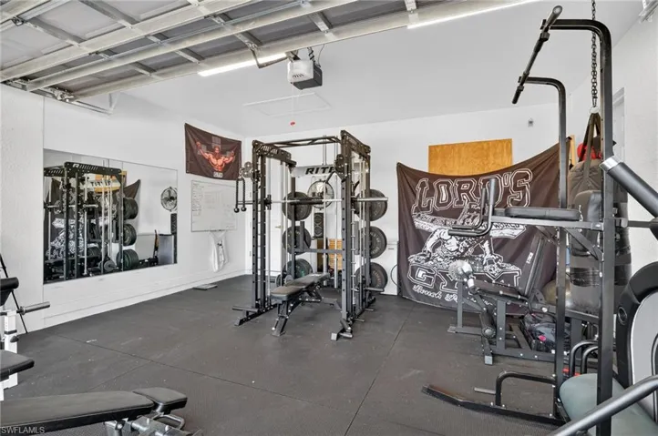 Exercise room with a garage