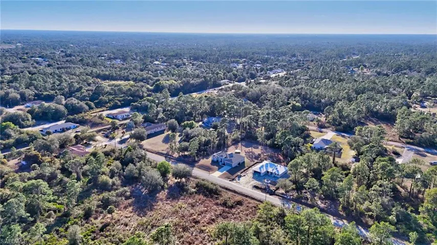 Aerial overview of property's location with a forest