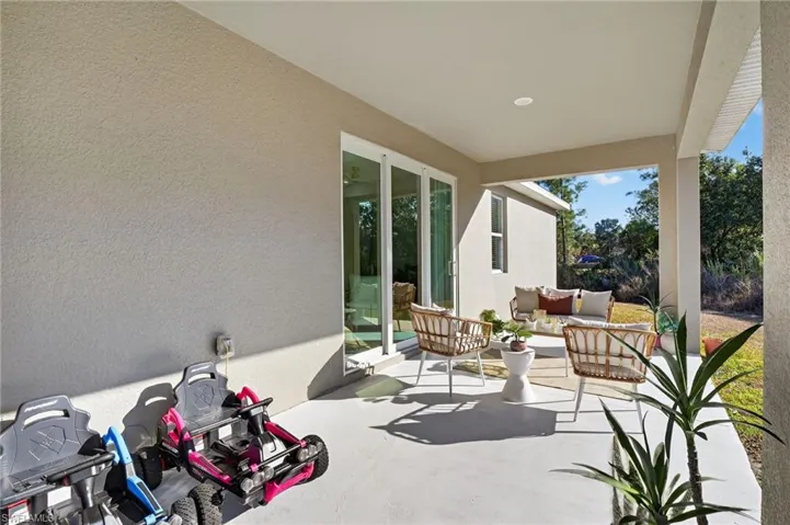 View of patio with an outdoor hangout area