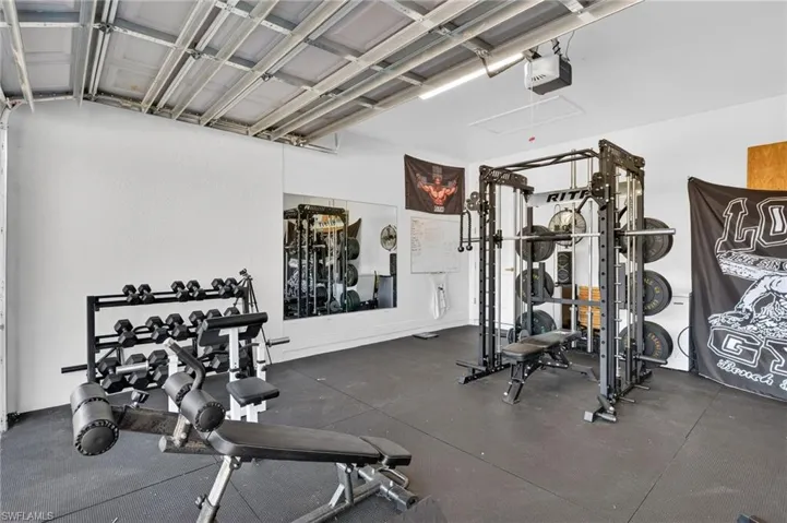 Exercise room with a garage
