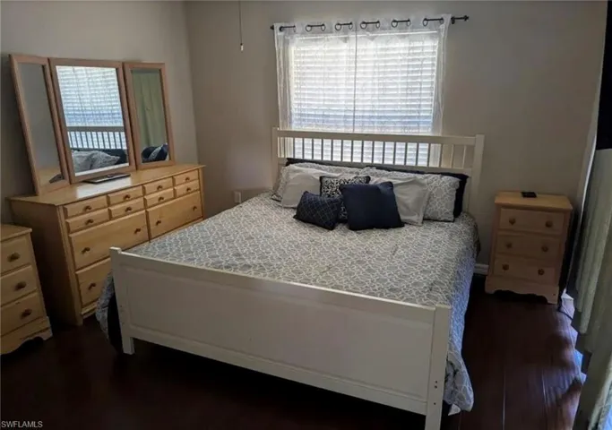 Bedroom featuring dark wood finished floors