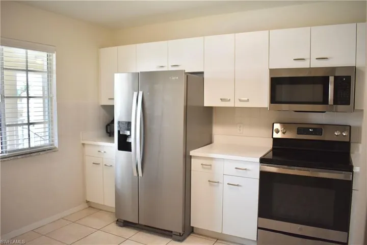 Kitchen with room for a table at the window with partial view of the lake