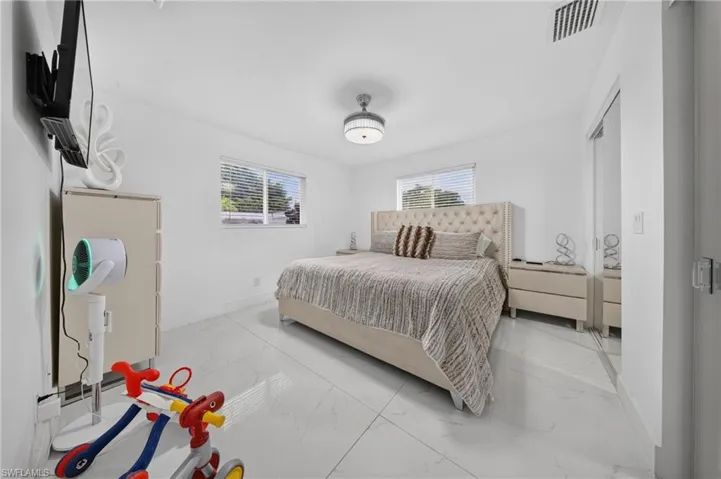 White tile flooring and white painted walls