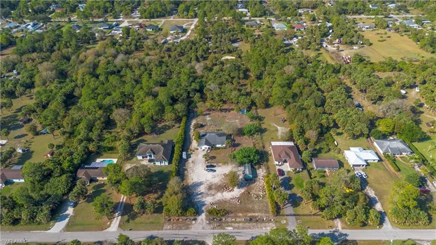 Aerial view of property's location with nearby suburban area