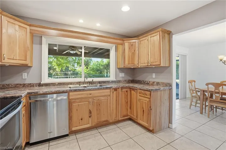 The Gourmet Kitchen is equipped with all NEW stainless appliances, natural wood cabinetry & a panoramic view!
