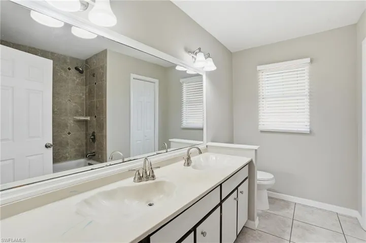 Guest Bath features Dual Sinks, a Fully Tiled Tub/Shower Combo and Linen Closet for added storage!