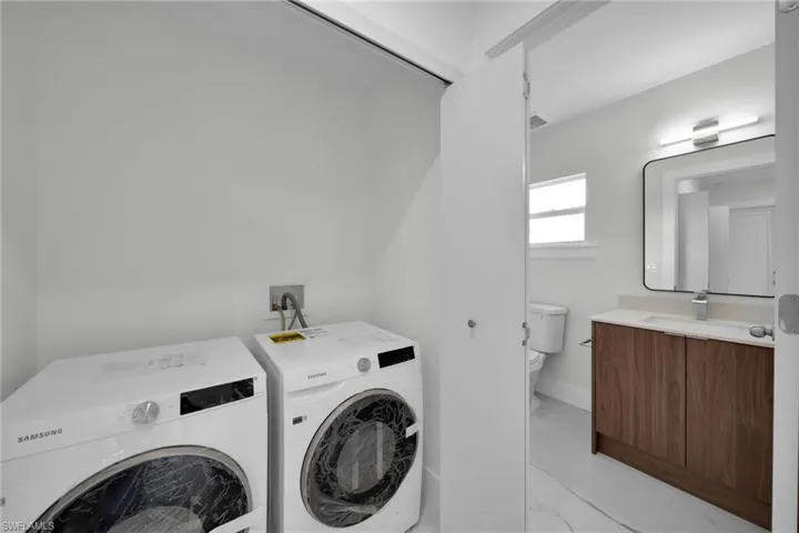Dedicated laundry area with side-by-side appliances