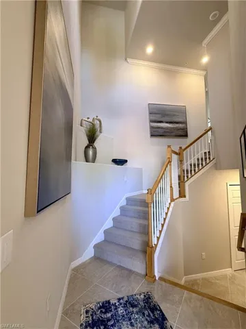 A warm, art-filled entry with soaring ceilings to greet your guests.