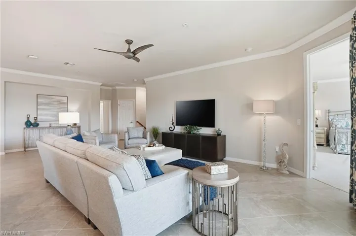 Large living room with seamless flow to the primary suite, ideal for entertaining or unwinding.