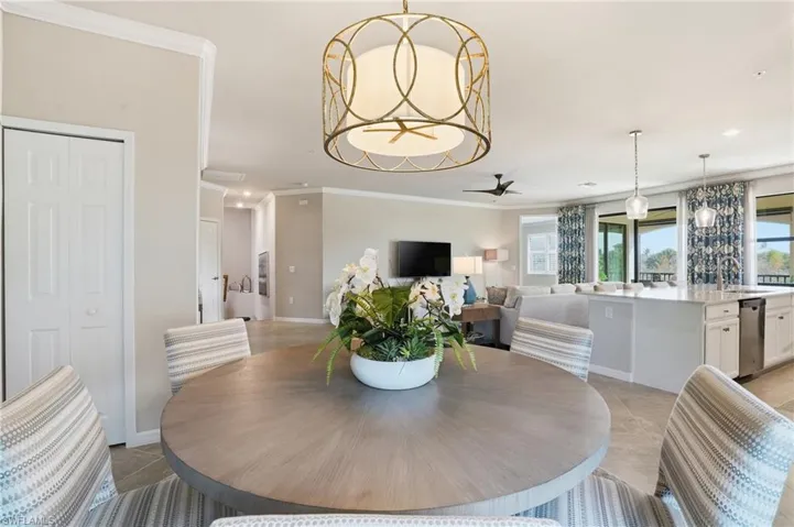Viewed from the dining room, the bright, neutral space connects effortlessly to the kitchen and living areas, creating an ideal setting for dinner parties and entertaining.