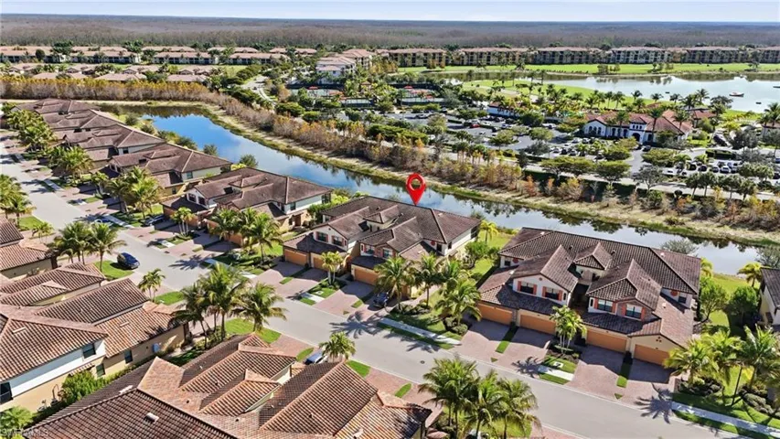 Aerial view of residential area featuring water and nature views