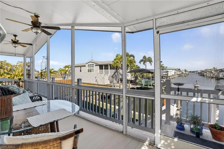 SCREEN PORCH OVERLOOKING THE GULF ACCESS CANAL