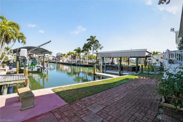 GULF ACCESS CANAL WITH ROOM TO DESIGN YOUR OWN DOCK AND LIFT.  QUICK BOATING ACCESS TO THE BEACH!