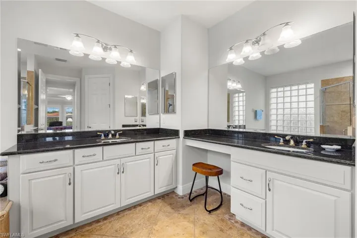 Bathroom featuring vanity and tile patterned floors