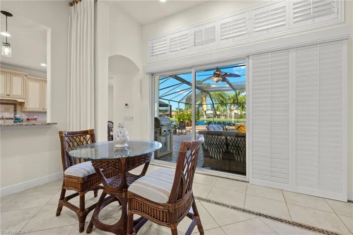 Tiled dining area with ceiling fan