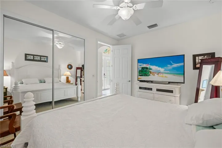 Bedroom featuring a closet, carpet flooring, and ceiling fan