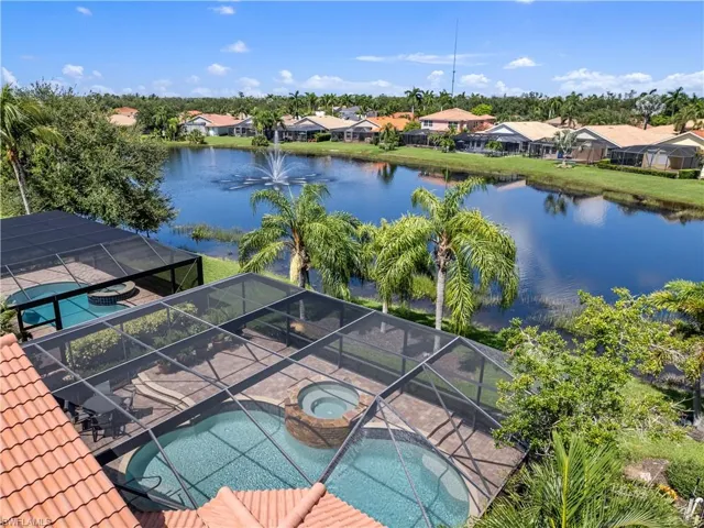 View of swimming pool featuring an in ground hot tub and a lanai