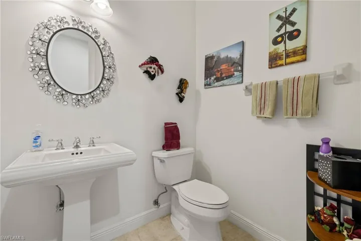 Bathroom with tile patterned floors, toilet, and sink