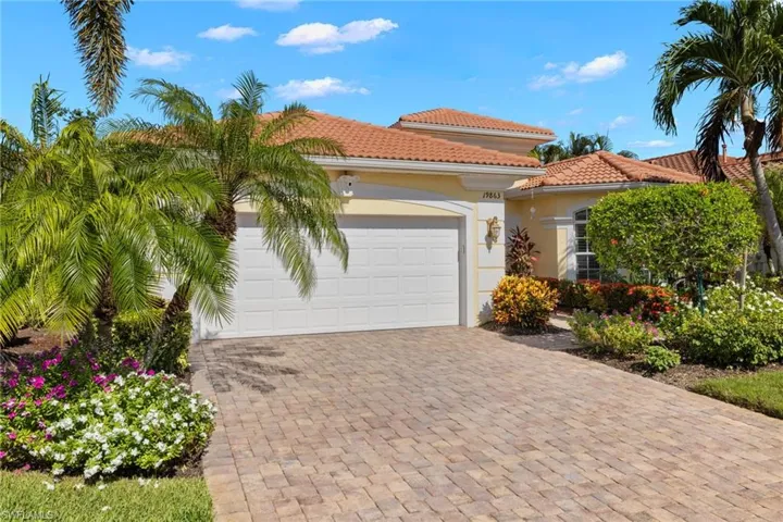 Mediterranean / spanish-style house with a garage