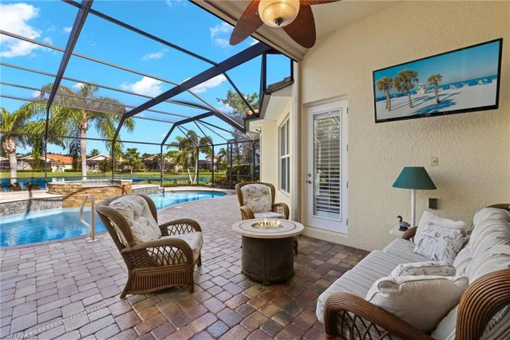 Sunroom featuring ceiling fan