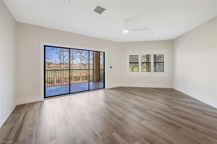 Featuring hardwood / wood-style flooring, plenty of natural light, and ceiling fan