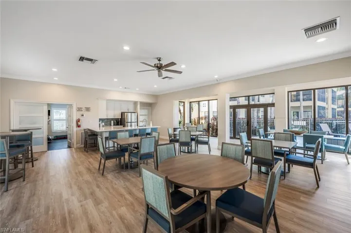 Dining room with crown molding, a healthy amount of sunlight, and light wood-type flooring