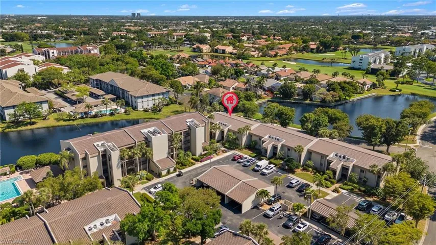 Birds eye view of property featuring a water view and a residential view